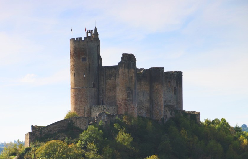 A picture of a stone fortress against a cloudy sky